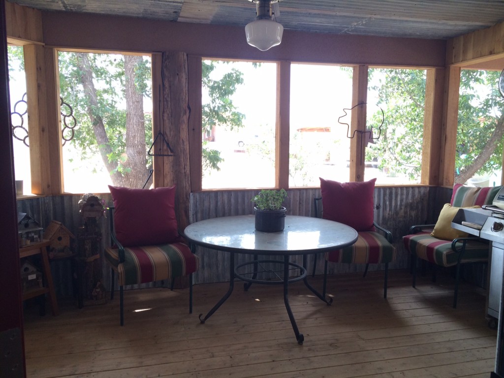 The screened in porch has been wonderful! It's amazing how much wind it blocks, and with the french doors opening to the outside, it will allow lots of extra seating on cattle drive weeks!